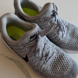 Nike Gray Flyknit Sneakers with Black Swoosh